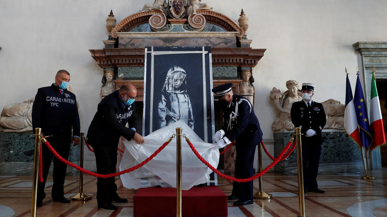 Italy returns stolen Banksy tribute to victims of 2015 Paris attacks to France on Bastille Day