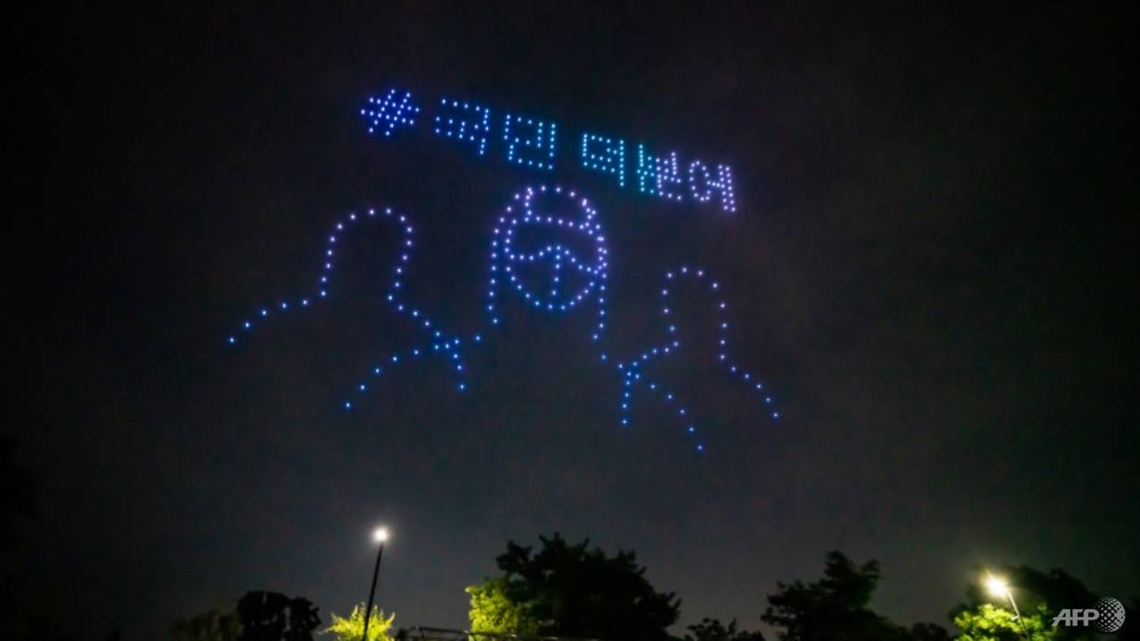 Hundreds of drones light up Seoul sky with virus messages