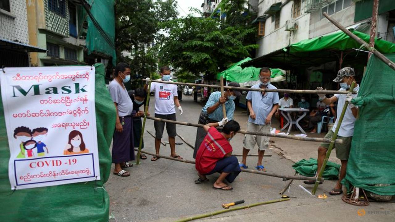 Myanmar residents barricade city streets as COVID-19 cases rise